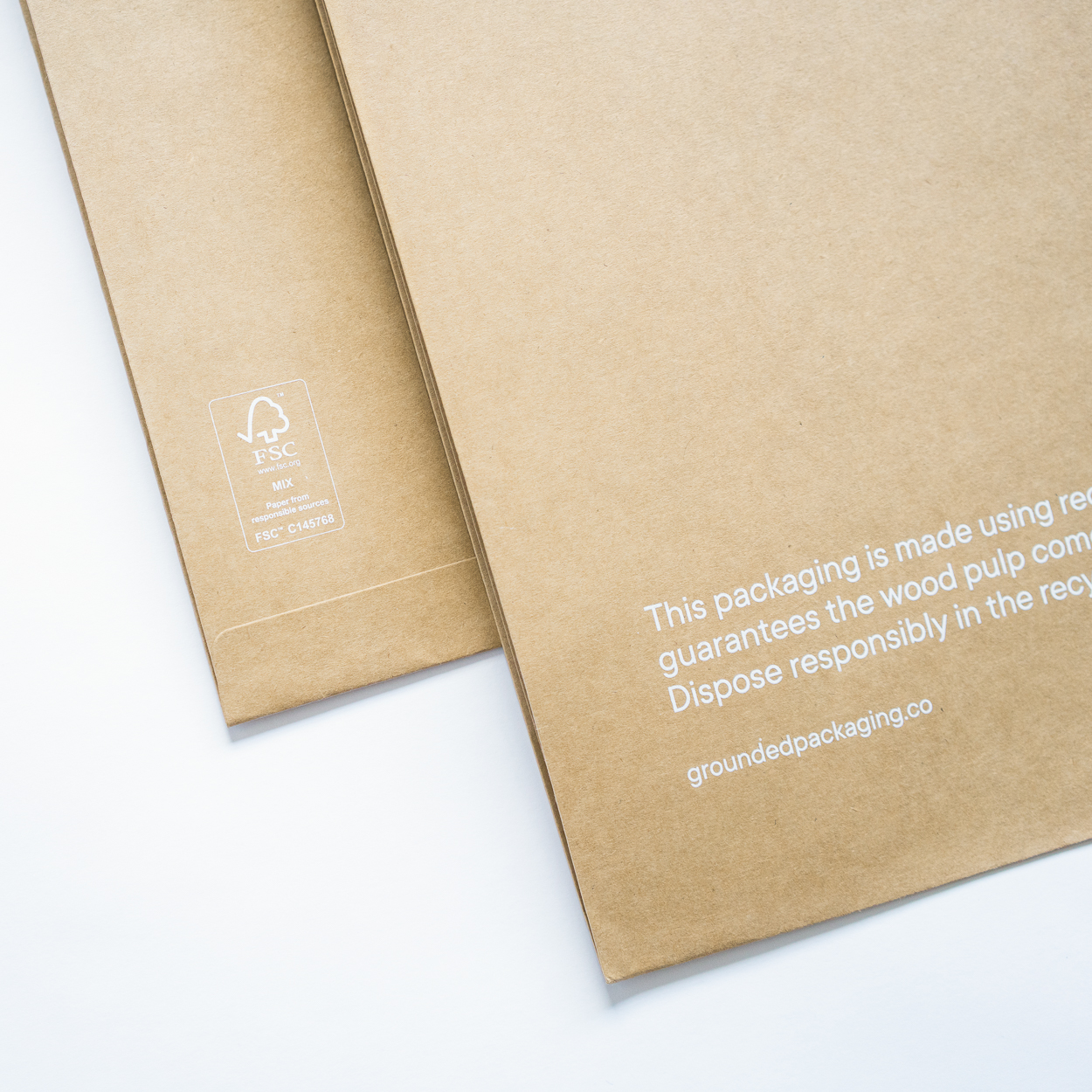 Expandable paper mailer Grounded Packaging